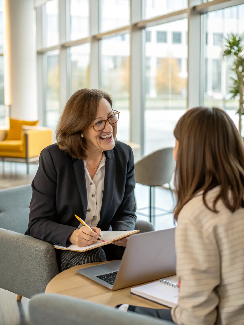 A professional executive coach in a modern office setting, guiding a client through a strategic planning session, focusing on goal setting and prioritization.